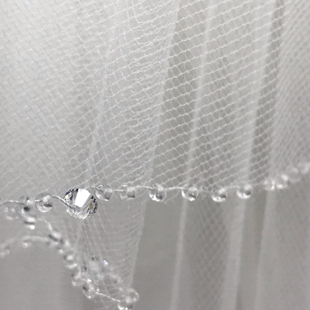 White hand stitched 40 inch veil.